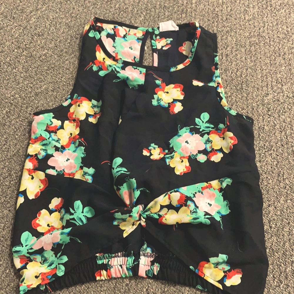 A black tank with floral accents